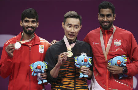 Badminton - Gold Coast 2018 Commonwealth Games - Men's Singles - Carrara Sports Arena 2 - Gold Coast, Australia - April 15, 2018. Gold medallist Lee Chong Wei of Malaysia, silver medallist Srikanth Kidambi of India and bronze medallist Rajiv Ouseph of England pose with their medals and Borobi plush dolls. REUTERS/Athit Perawongmetha