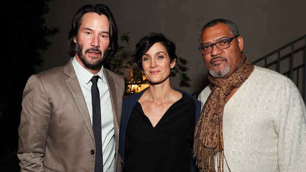 Laurence Fishburne, left, and Keanu Reeves, cast members in John Wick:  Chapter 2, pose together at the premiere of the film at ArcLight Cinemas  on Monday, Jan. 30, 2017, in Los Angeles. (