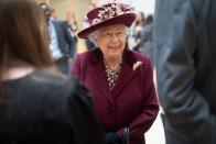 <p>Queen Elizabeth speaks with MI5 officers during a covert visit to the agency's headquarters in February.</p>