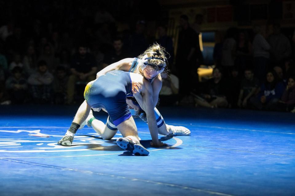 PHOTO: Maddie Ripley shows off her moves on the mat on Feb. 17, 2024, as she won the Maine state high school Class B wrestling championship against a male opponent from Belfast Area High School. (Amy Murphy Photography)