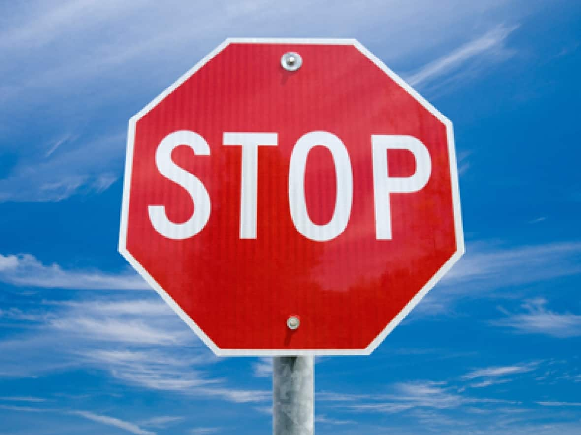 A stock image shows a stop sign. Manitoba RCMP say an initial investigation has determined a car headed north on Provincial Road 274 Wednesday night failed to stop at a sign and hit the trailer part of a semi. (Shutterstock - image credit)