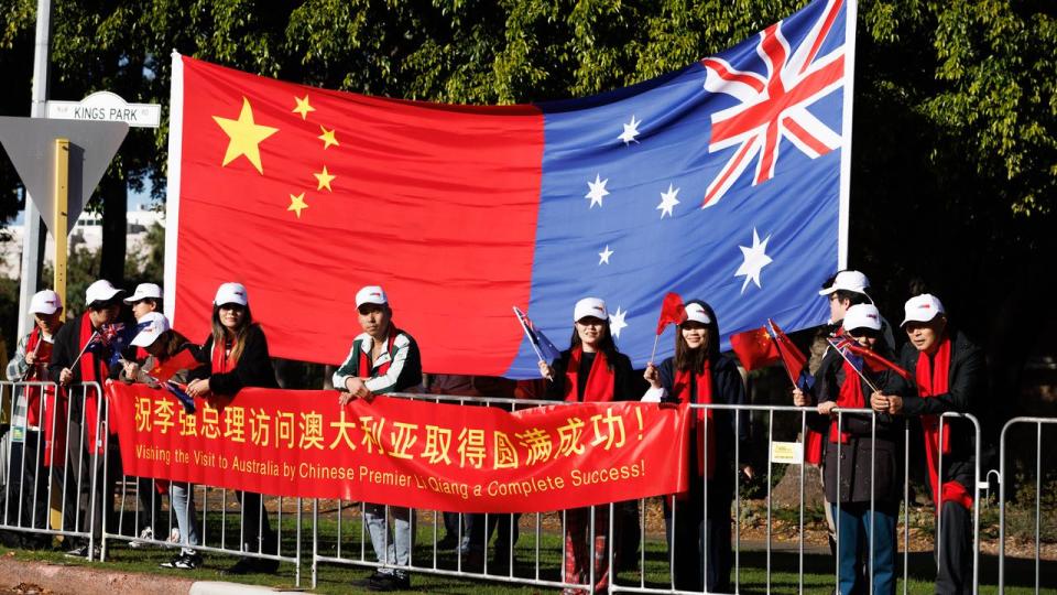 Chinese supporters awaiting the arrival of Premier Li Qiang