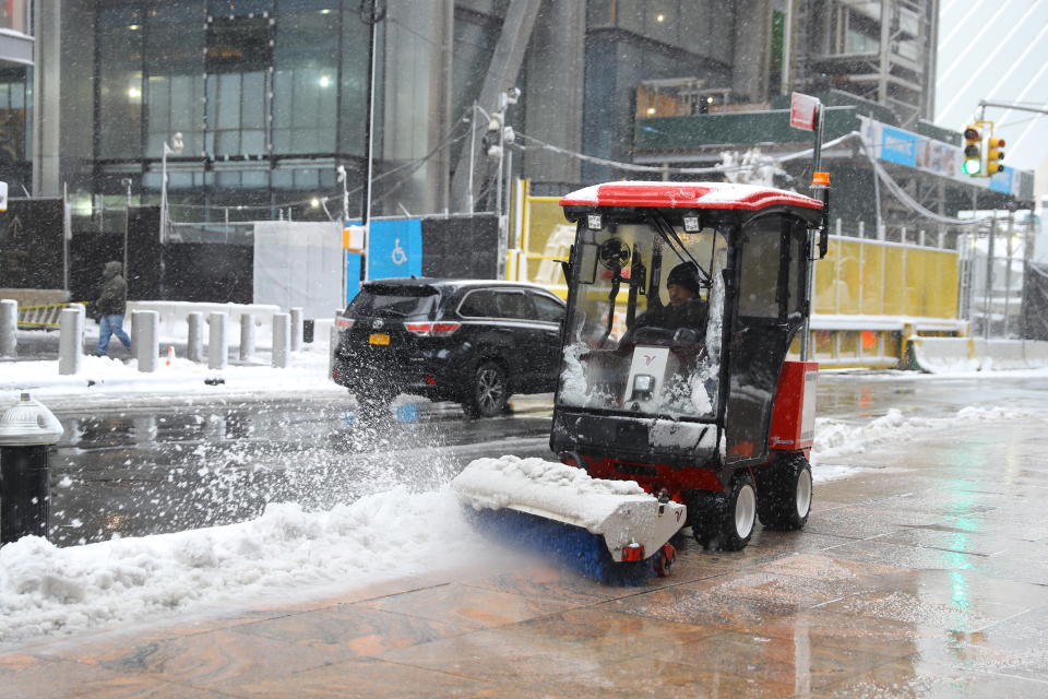 <p>A maintenance worker clears the sideway with a snow plow in lower Manhattan in New York City as a spring storm hit the Northeast on Wednesday, March 21, 2018. (Photo: Gordon Donovan/Yahoo News) </p>