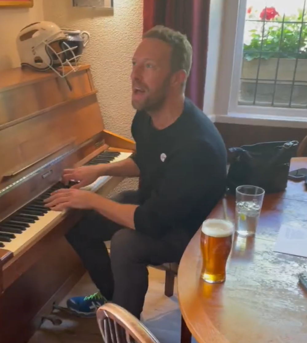 Chris Martin performed Coldplay’s A Sky Full of Stars for pubgoers near Bath (Chris Parkin/PA)