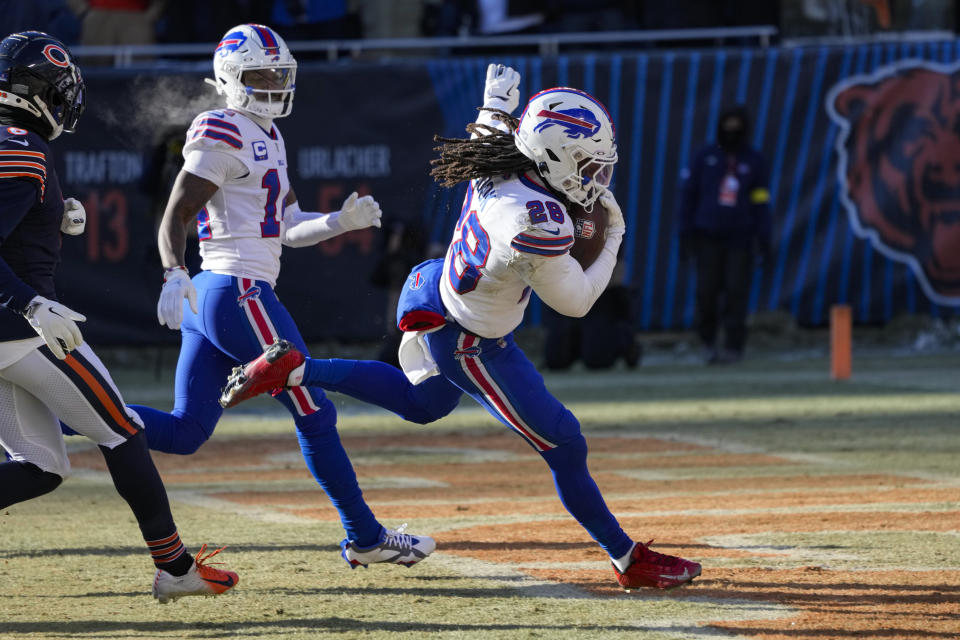 Buffalo Bills running back James Cook (28) runs in for a touchdown against the Chicago Bears in the second half of an NFL football game in Chicago, Saturday, Dec. 24, 2022. (AP Photo/Charles Rex Arbogast)