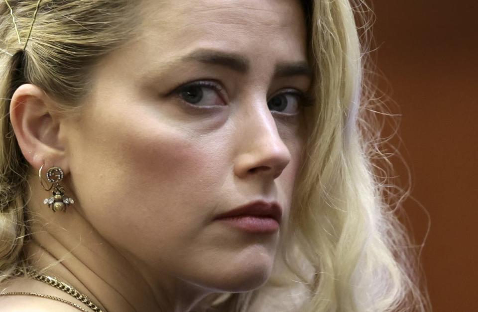 <div class="inline-image__caption"><p>Amber Heard waits before the jury announced a split verdict in favor of both Johnny Depp and Amber Heard on their claim and counter-claim in the <em>Depp v. Heard</em> civil defamation trial at the Fairfax County Circuit Courthouse in Fairfax, Virginia, on June 1, 2022. </p></div> <div class="inline-image__credit">Evelyn Hockstein/AFP/Getty</div>