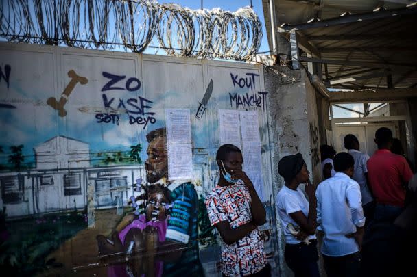 PHOTO: In this Nov. 3, 2022, file photo, people wait at the door to see their relatives at a clinic run by Doctors Without Borders in the Tabarre neighborhood of Port-au-Prince, Haiti. (Ramon Espinosa/AP, FILE)