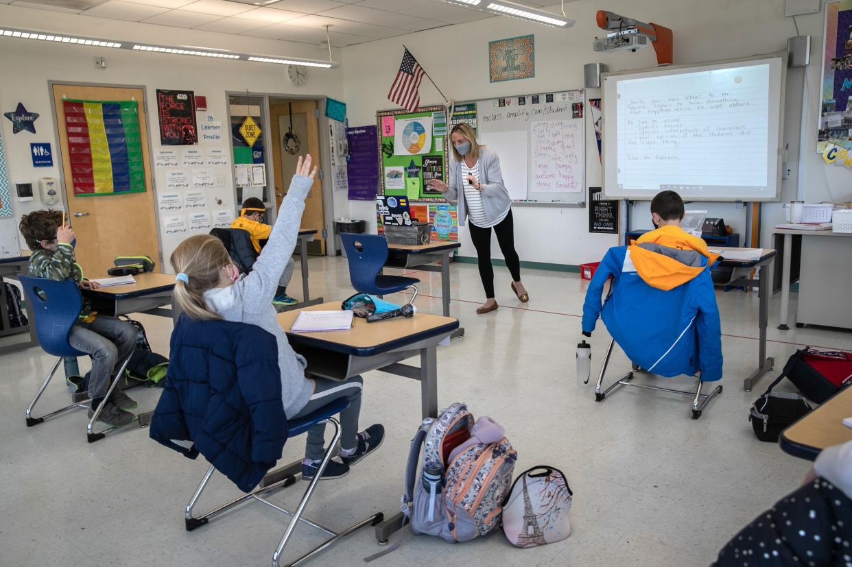 Third grade teacher Cara Denison speaks to students in November while live-streaming her class via Google Meet at Rogers International School in Stamford, Connecticut. (Photo: John Moore via Getty Images)