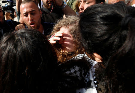 Palestinian teenager Ahed Tamimi is welcomed by relatives and supporters after she was released from an Israeli prison, at Nabi Saleh village in the occupied West Bank July 29, 2018. REUTERS/Mohamad Torokman