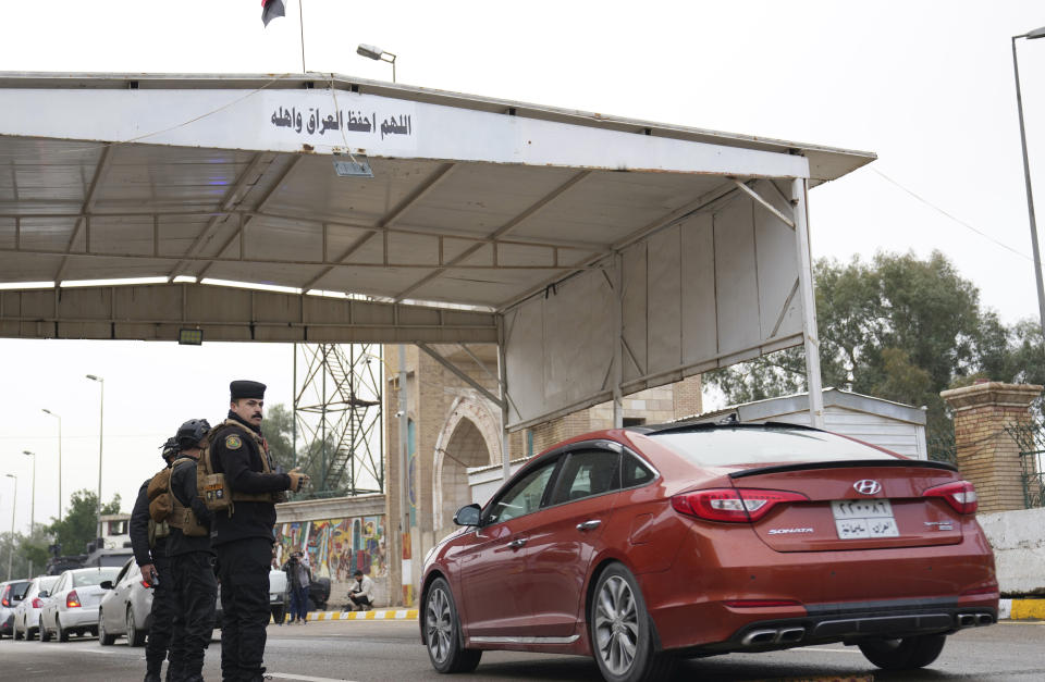 Iraqi security forces stand guard as they check motorists entering the Green Zone, in Baghdad, Iraq, Sunday, Jan. 8, 2023. (AP Photo/Hadi Mizban)