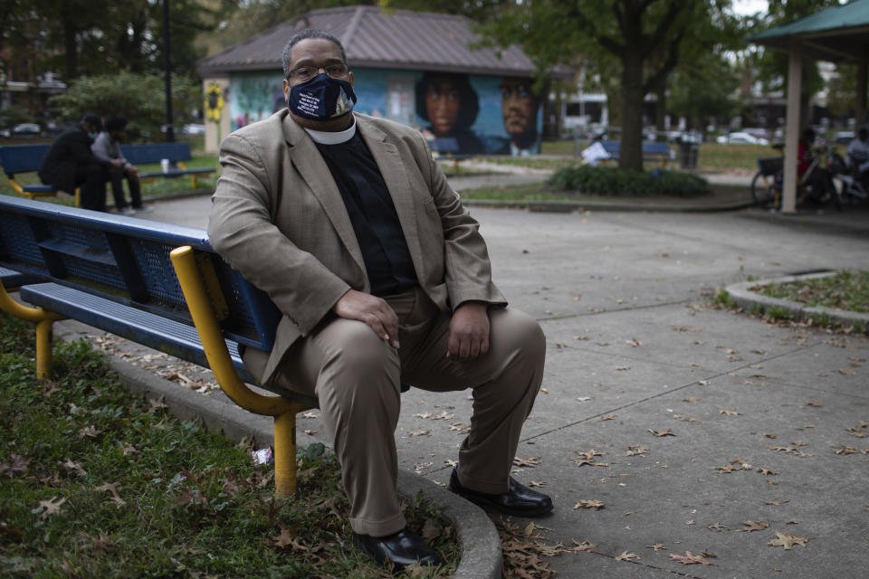 Bishop Duane Royster sits on a bench in a park in Philadelphia on Wednesday, Oct. 28, 2020. Royster is the interim executive director of POWER Interfaith, a group of religious leaders from more than 50 congregations in Pennsylvania that focuses on social justice issues, and has been active in the community following the police shooting death of Walter Wallace, Jr. (AP Photo/Robert Bumsted)