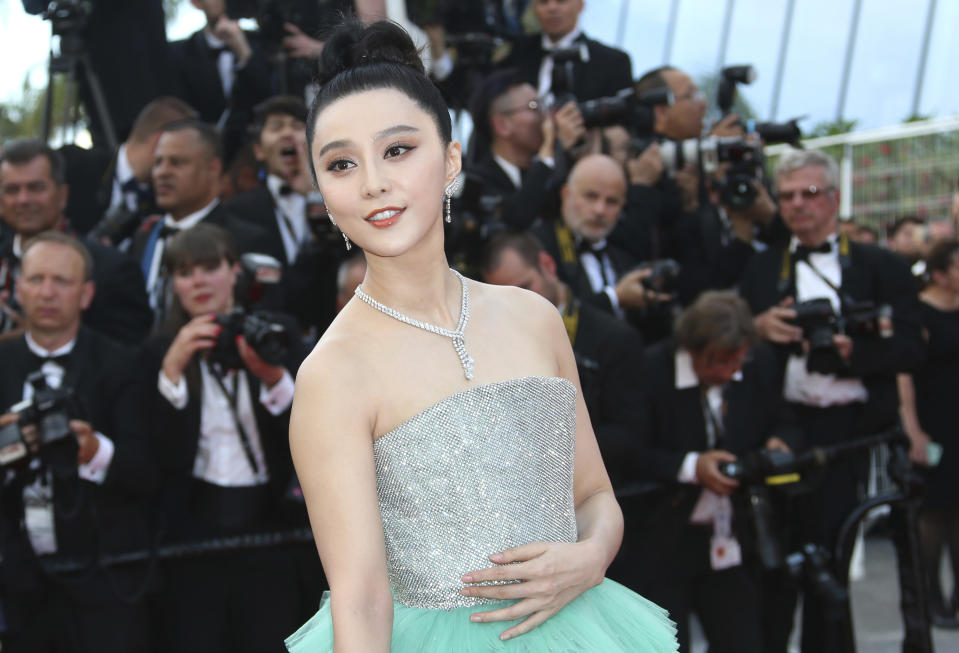 FILE - Chinese actress Fan Bingbing poses for photographers upon arrival at the opening ceremony of the 71st international film festival, Cannes, southern France, May 8, 2018. The disappearance of tennis star Peng Shuai in China following her accusations of sexual assault against a former top Communist Party official has shined a spotlight on similar cases involving political dissidents, entertainment figures, business leaders and others who have run afoul of the authorities. (Photo by Joel C Ryan/Invision/AP, File)