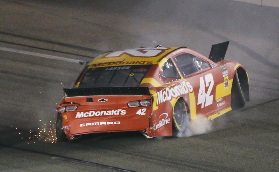 Kyle Larson backs his car down the track after he spun during the NASCAR Cup series auto race at Richmond Raceway in Richmond, Va., Saturday, April 13, 2019. (AP Photo/Steve Helber)