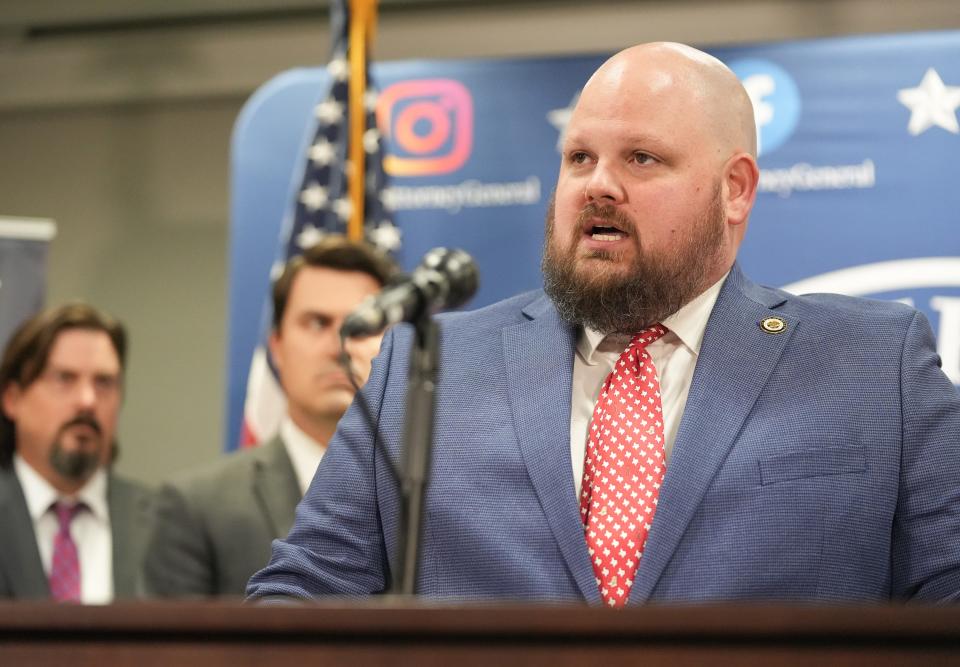 Chris Hilton, chief of the attorney general’s General Litigation Division, defends Attorney General Ken Paxton at Friday's news conference.