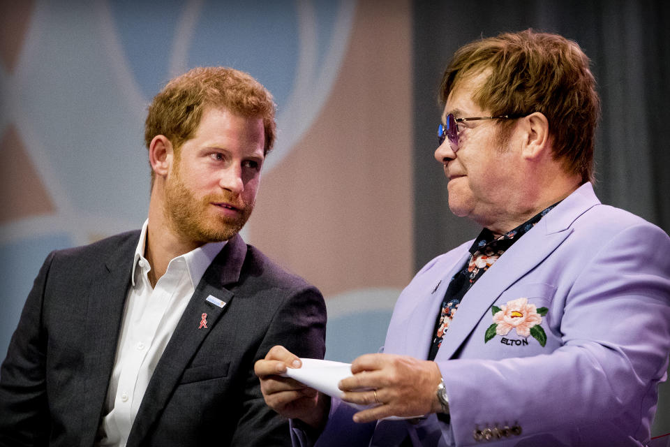 AMSTERDAM, NETHERLANDS - JULY 24: Sir Elton John and Prince Harry, Duke of Sussex attend the 2018 International AIDS Conference  on July 24, 2018 in Amsterdam, Netherlands. (Photo by Patrick van Katwijk/Getty Images)