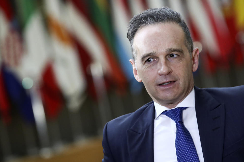 German Foreign Minister Heiko Maas speaks to the media as he arrives for a meeting of EU foreign ministers at the European Council building in Brussels, Monday, Feb 22, 2021. European Union foreign ministers on Monday will look at options for imposing fresh sanctions against Russia over the jailing of opposition leader Alexei Navalny as the 27-nation bloc considers the future of its troubled ties with the country. (Yves Herman, Pool via AP)