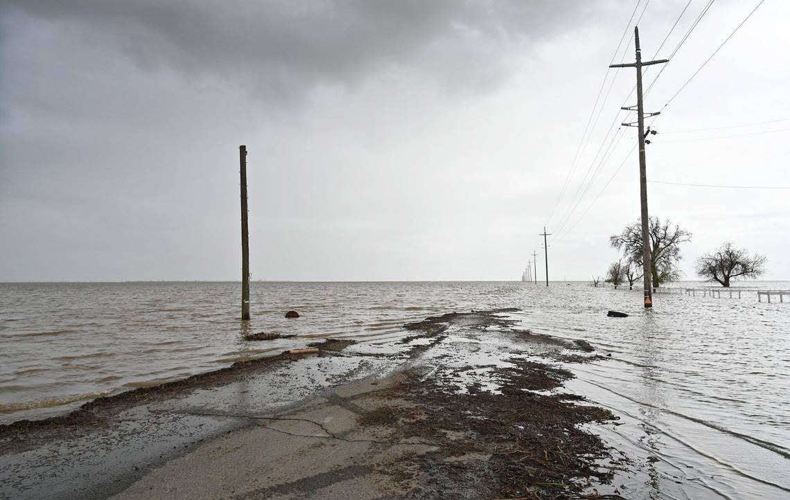 Southbound Dairy Avenue disapears beneath extensive flooding, seen about 4 miles south of Corcoran where flooding is re-creating the historic Tulare Lake. Photographed Wednesday, March 22, 2023 near Corcoran, California.