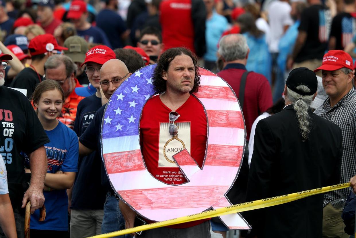 <span class="caption">The big question looming over QAnon: What happens after March 4?</span> <span class="attribution"><a class="link " href="https://www.gettyimages.com/detail/news-photo/david-reinert-holds-a-large-q-sign-while-waiting-in-line-on-news-photo/1009769900?adppopup=true" rel="nofollow noopener" target="_blank" data-ylk="slk:Rick Loomis/Getty Images;elm:context_link;itc:0;sec:content-canvas">Rick Loomis/Getty Images</a></span>