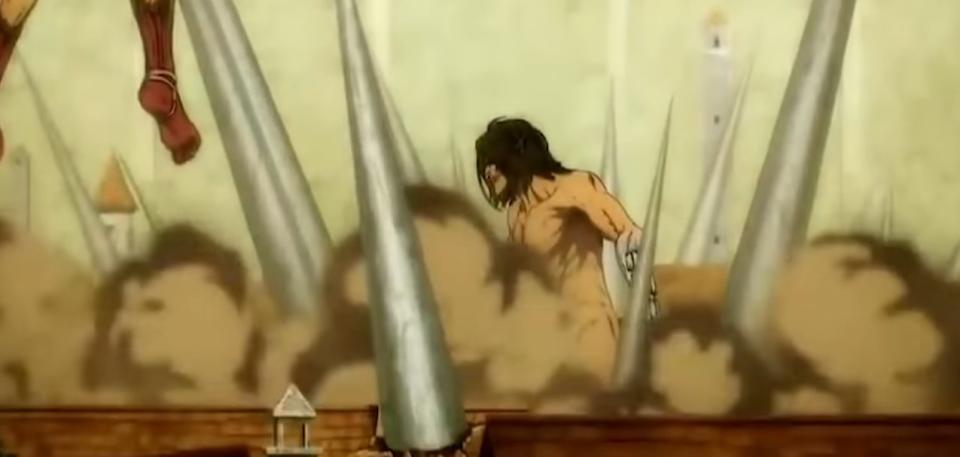 Eren in his Titan form using his Warhammer spikes to skewer Reiner and Galliards Titans