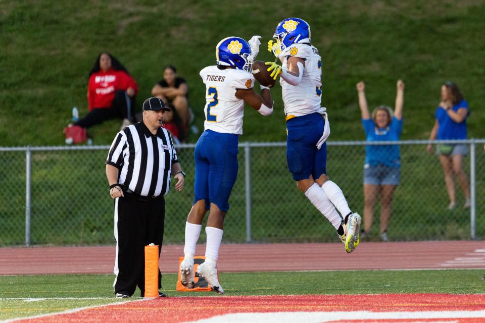Orem players celebrate a touchdown during their high school football season opener against East at East High School in Salt Lake City on Friday, Aug. 11, 2023. | Megan Nielsen, Deseret News