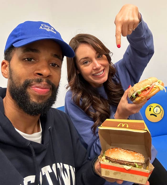 The authors holding their burgers