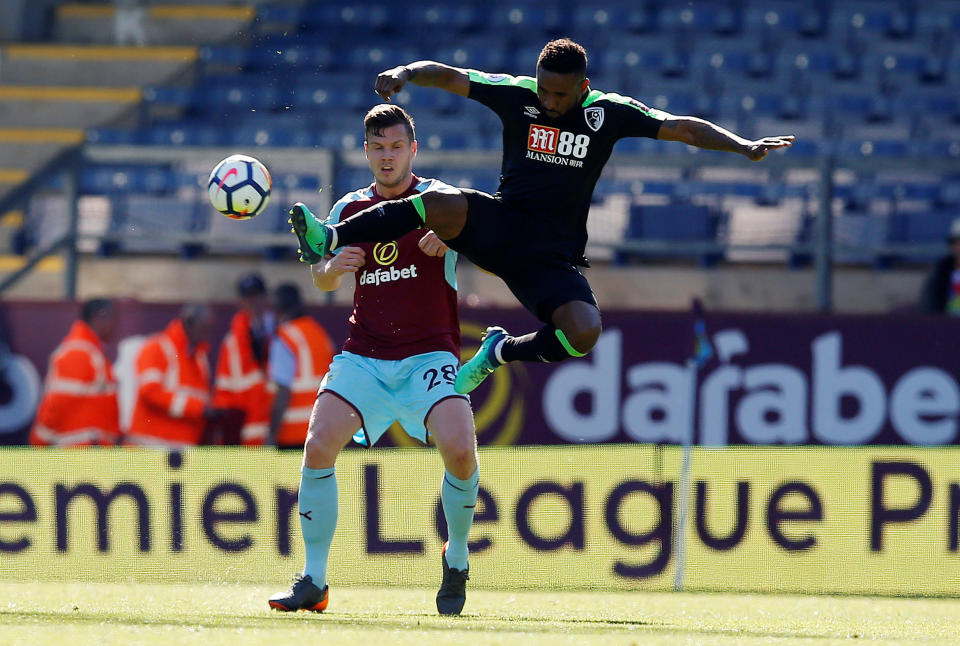 Is he heading north of the border: Jermain Defoe in action with Burnley’s Kevin Long last weekend