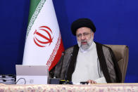 In this photo released by the official website of the office of the Iranian Presidency, President Ebrahim Raisi speaks during a cabinet meeting in Tehran, Iran, Wednesday, Oct. 27, 2021. Raisi said Wednesday that a cyberattack which paralyzed every gas station in the Islamic Republic was designed to get "people angry by creating disorder and disruption," as long lines still snaked around the pumps a day after the incident began. (Iranian Presidency Office via AP)