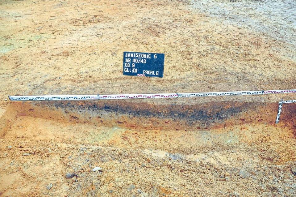 Under the sand were the remants of an ancient settlement, including cellars and holes that once held posts, archaeologists said.