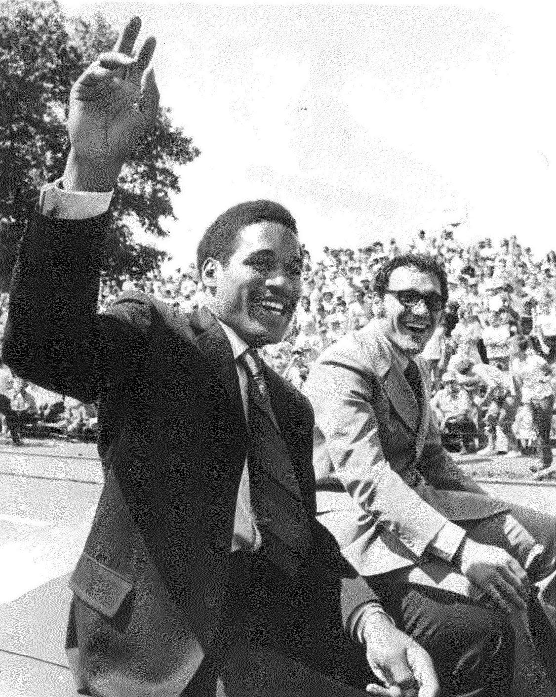 Buffalo Bills rookie O.J. Simpson waves to the Akron crowd at the All-American Soap Box Derby while riding in a convertible at Derby Downs on Aug. 23, 1969.