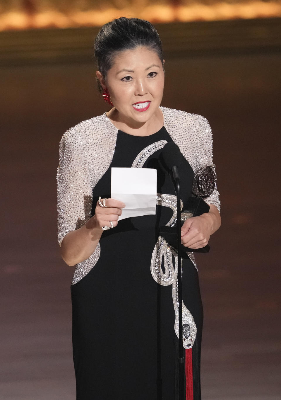 Linda Cho accepts the award for best costume design of a musical for "The Great Gatsby" during the 77th Tony Awards on Sunday, June 16, 2024, in New York. (Photo by Charles Sykes/Invision/AP)