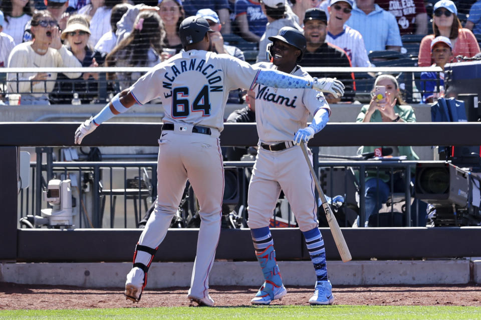 Miami Marlins' Jerar Encarnacion (64) celebrates with Jazz Chisholm Jr. after hitting a grand slam against New York Mets relief pitcher Seth Lugo during the seventh inning of a baseball game, Sunday, June 19, 2022, in New York. (AP Photo/Jessie Alcheh)