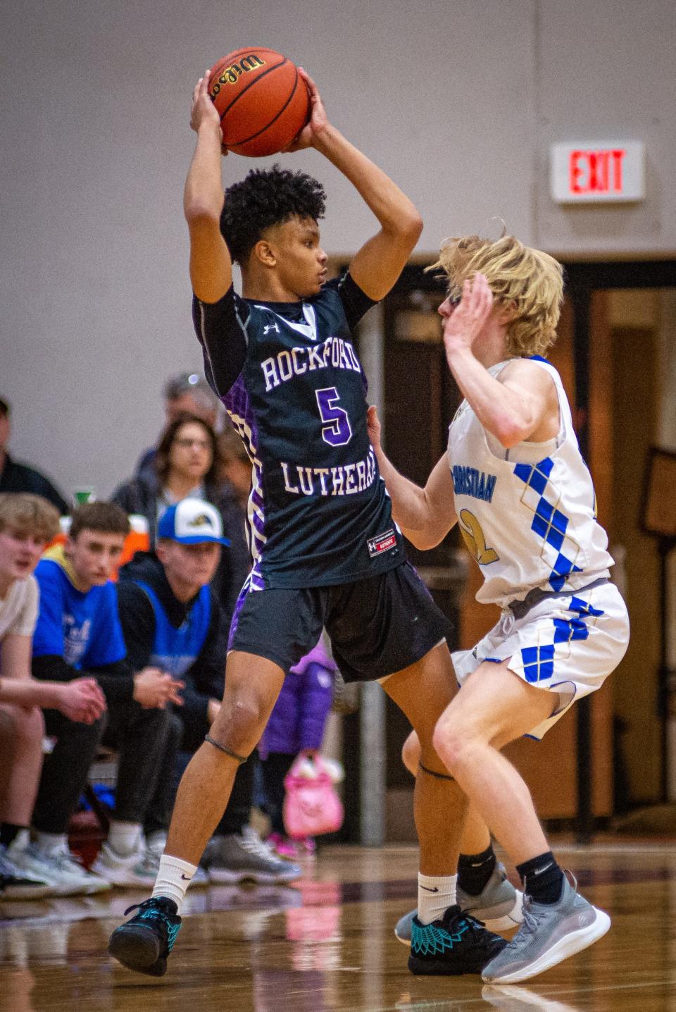 Lutheran's Walt Hill, Jr., shown trying to get past Rockford Christian's Noah Reese at Marengo High School on Friday, Feb. 18, 2022, had a strong start to the season for the Crusaders last week, averaging just under 28 points through four games.