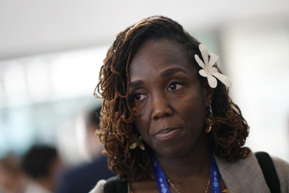 Rueanna La Toya Tonia Haynes, of Trinidad and Tobago, speaks to members of the media at the COP28 U.N. Climate Summit, Wednesday, Dec. 13, 2023, in Dubai, United Arab Emirates. (AP Photo/Peter Dejong)