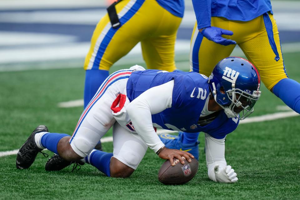 New York Giants quarterback Tyrod Taylor (2) reacts after being sacked during the first half an NFL football game against the Los Angeles Rams, Sunday, Dec. 31, 2023, in East Rutherford, N.J. (AP Photo/Seth Wenig)