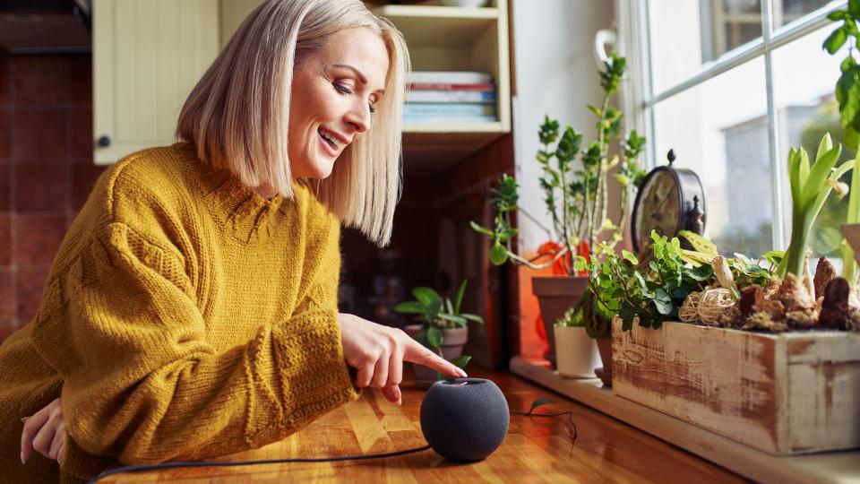 A woman using her Amazon Alexa