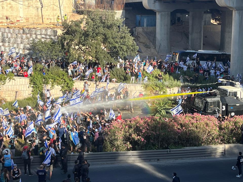 Israeli police clash with protesters near the parliament in Jerusalem after the Knesset passed controversial judicial legislation on July 24, 2023, to weaken Supreme Court oversight of the government.