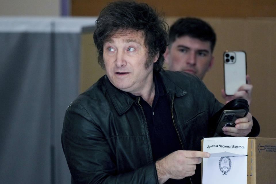 Presidential candidate of the Liberty Advances coalition Javier Milei votes during the presidential runoff election in Buenos Aires, Argentina, Sunday, Nov. 19, 2023. (AP Photo/Natacha Pisarenko)