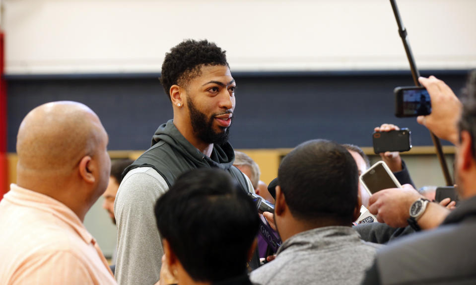 New Orleans Pelicans forward Anthony Davis talks to reporters after their NBA basketball practice in Metairie, La., Friday, Feb. 1, 2019. (AP Photo/Gerald Herbert)