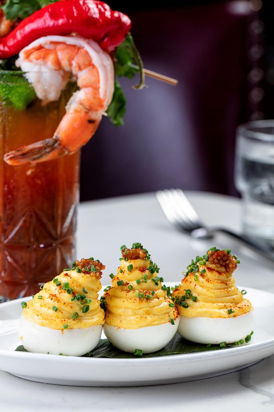 At The Wine Room Kitchen & Bar in Delray Beach, moms can enjoy bottomless mimosas and bloody marys along with brunch items like deviled eggs.