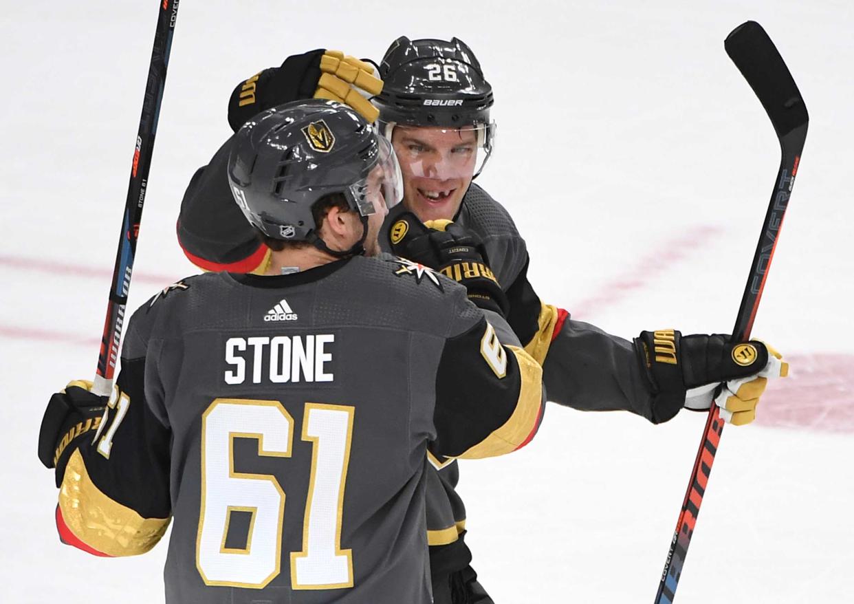 Apr 4, 2019; Las Vegas, NV, USA; Vegas Golden Knights right wing Mark Stone (61) celebrates with Vegas Golden Knights center Paul Stastny (26) after scoring a first period goal against the Arizona Coyotes at T-Mobile Arena. Mandatory Credit: Stephen R. Sylvanie-USA TODAY Sports