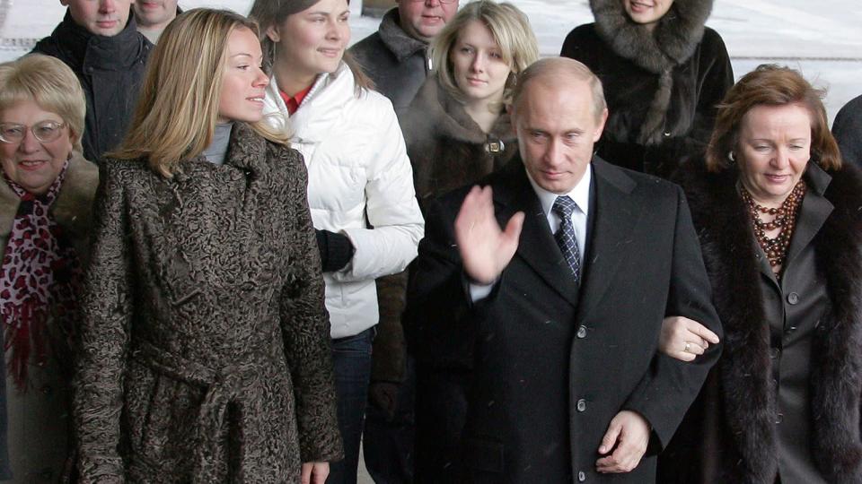 Russian President Vladimir Putin (C), his wife Ludmila (R) and daughter Maria (2ndL)