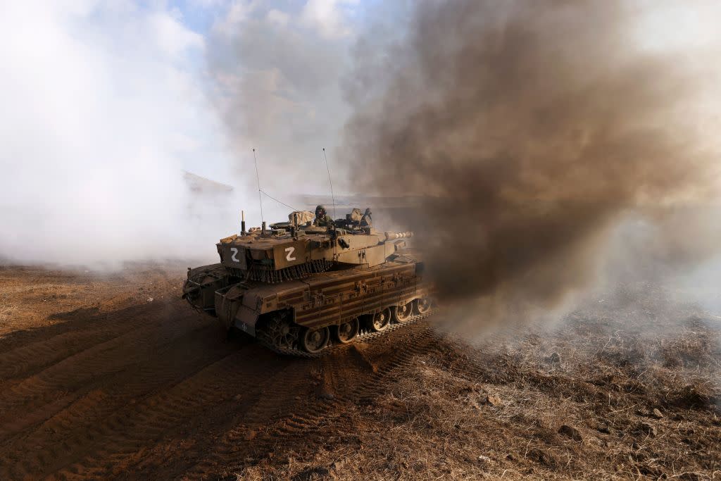  An Israeli tank takes part in an military exercise near Kibbutz Ortal in the Israel-annexed Golan Heights near the Lebanon border on November 15, 2023. 