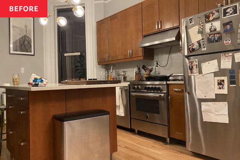 Grey kitchen with wood-finished cabinets before renovation