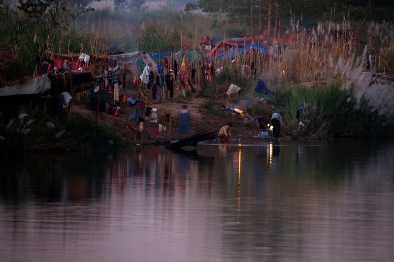 Myanmar refugees settle temporarily on the Moei River Bank, in Mae Sot