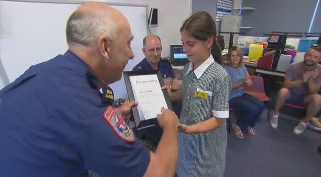 Tehya Clarke was recognised by Ambulance Victoria for a Triple 0 call that saved her mum's life. Photo: 7News