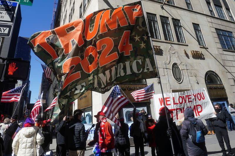 Former U.S. President Donald Trump supporters attend a rally in front of Trump Tower in New York