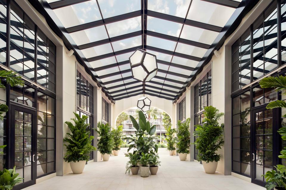 A soaring atrium at the Goodtime Hotel welcomes guests.