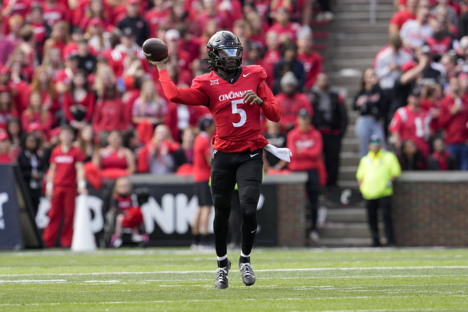 Cincinnati quarterback Emory Jones looks to throw during the second half of an NCAA college football game against Iowa State, Saturday, Oct. 14, 2023, in Cincinnati. (AP Photo/Jeff Dean)