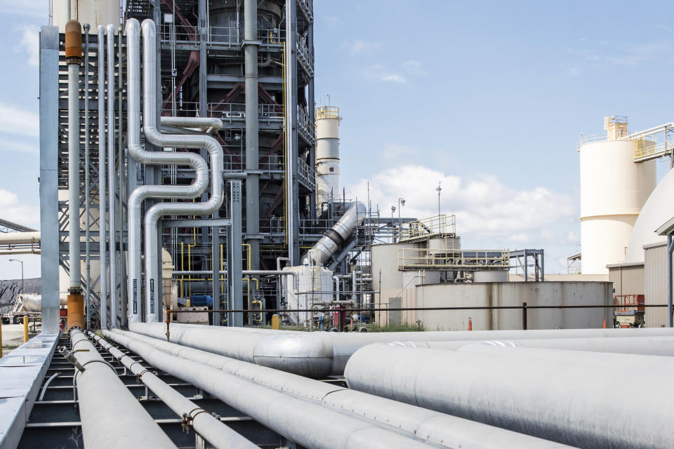 This July 20, 2016 photo provided by The SEFA Group shows a coal ash processing facility in Georgetown, S.C. Fly ash is enclosed in pipes and pneumatically conveyed for use as a sustainable material in concrete as part of SEFA Group's STAR Process. As Virginia and its public utilities struggle to cope with the coal ash buried in pits and ponds across the state, tons more of the industrial byproduct is being imported each year. (The Sefa Group via AP)