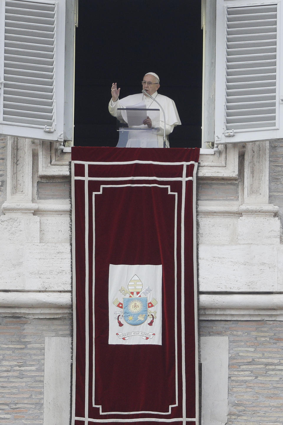 Pope Francis delivers his blessing during the Angelus noon prayer from his studio's window overlooking St. Peter's Square at the Vatican, Sunday, Nov. 4, 2018. (AP Photo/Gregorio Borgia)